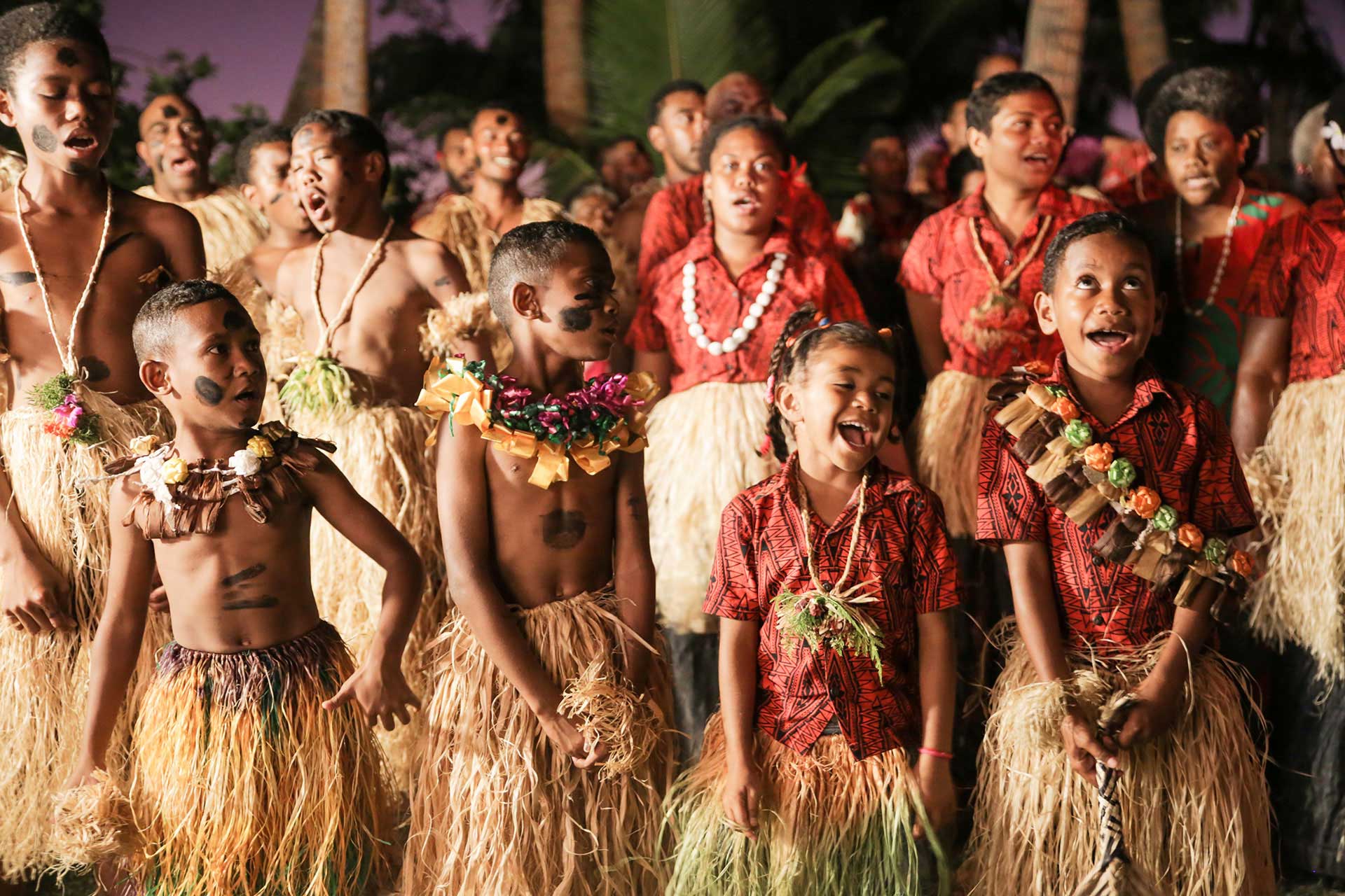 Every meticulously Fijian crafted detail seamlessly integrates into yourAll-Inclusive Vacation Packages Fiji. Image shows a Fijian cultural experience.