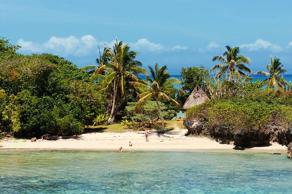 An image of a family enjoying the Jean-Michel Cousteau Resort Fiji's Private island as part of their family vacation in Fiji.