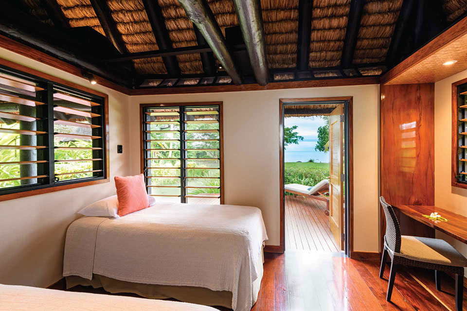 Fijian style Oceanfront 2-bedroom bures with contemporary furnishings at Jean-Michel Cousteau Resort Fiji.