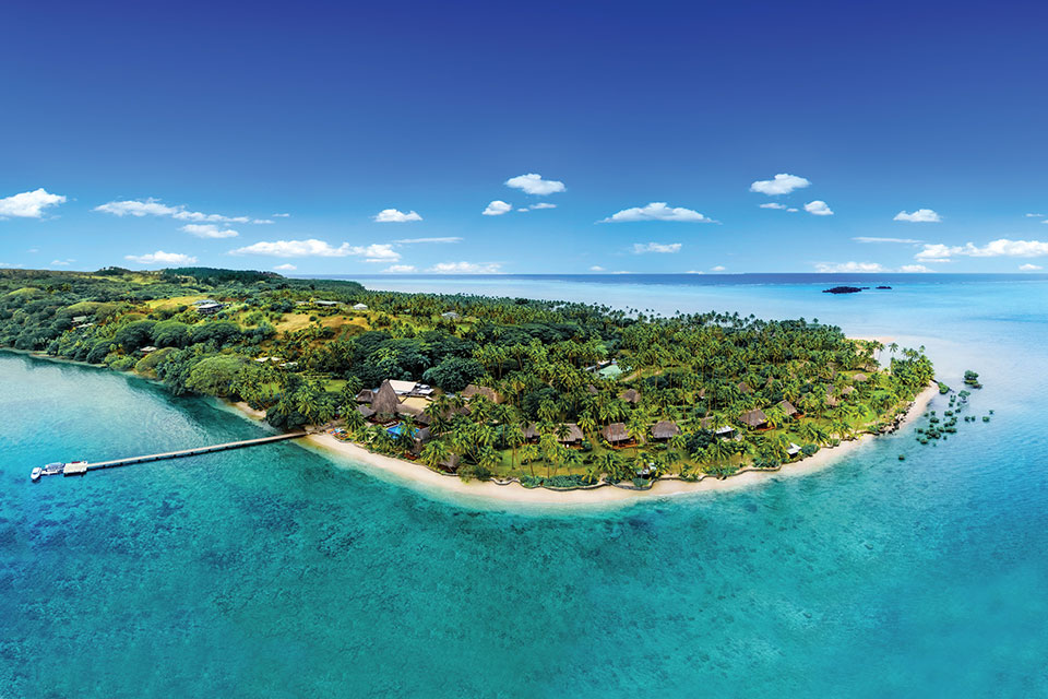 Aerial view of the peninsula showing Fijian cultural thatched bures.